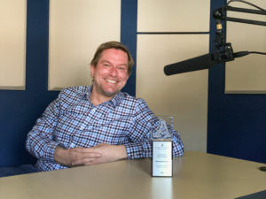 Geoff sitting at a desk